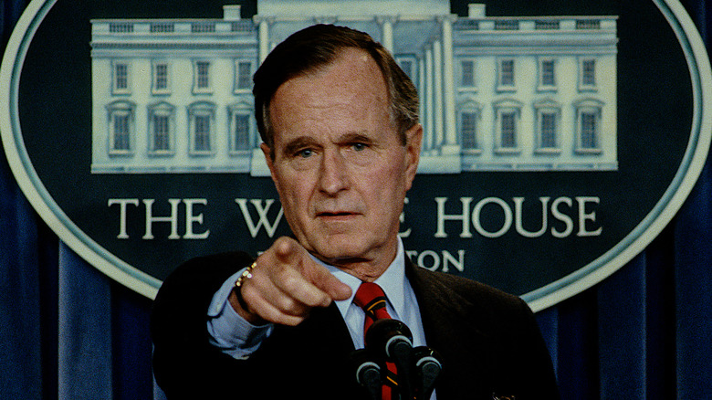 George H.W. Bush pointing in the White House press room