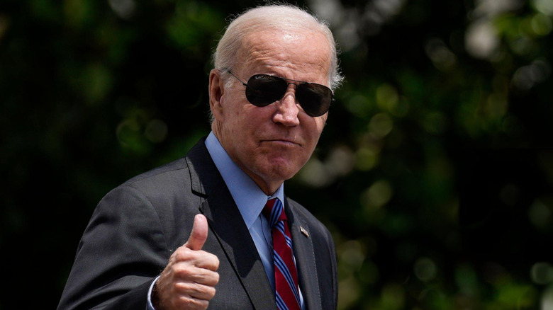 U.S. President Joe Biden gives a thumbs up on the South Lawn of the White House