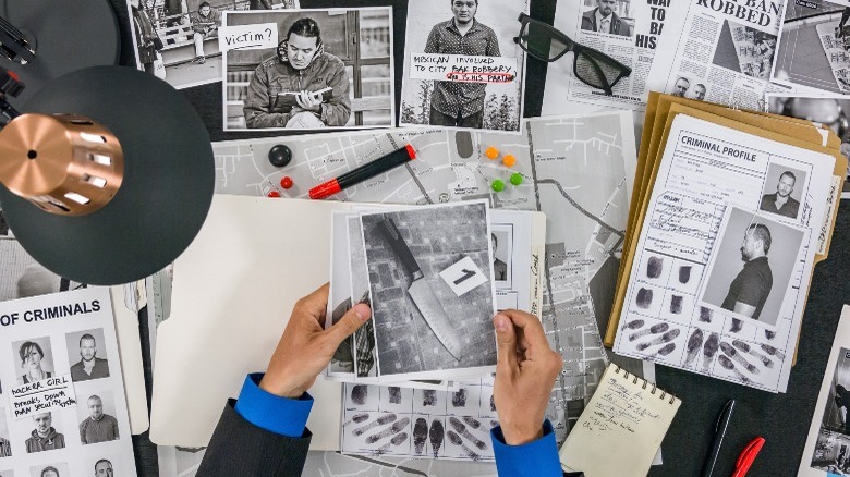 Investigator looking at files