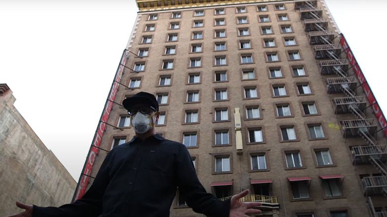 Zak in front of the Cecil Hotel