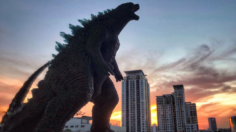 Godzilla screeching above city