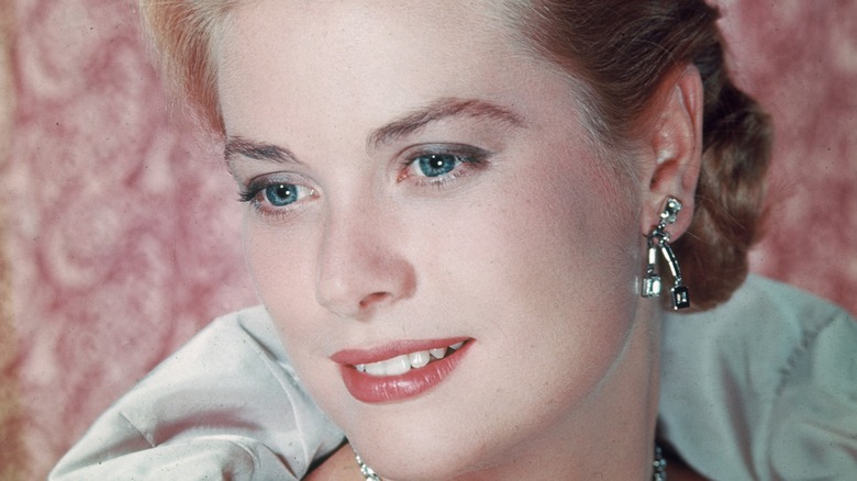 Grace Kelly posing for photo, smiling