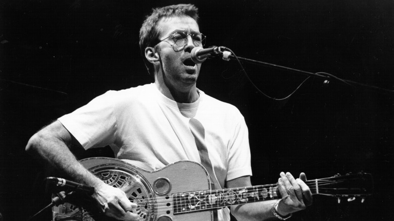 Eric Clapton singing while playing guitar