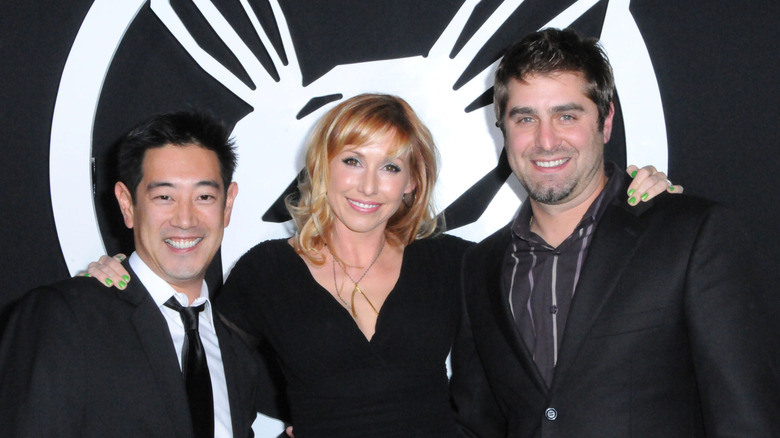 Grant Imahara smiling with cast of Mythbusters