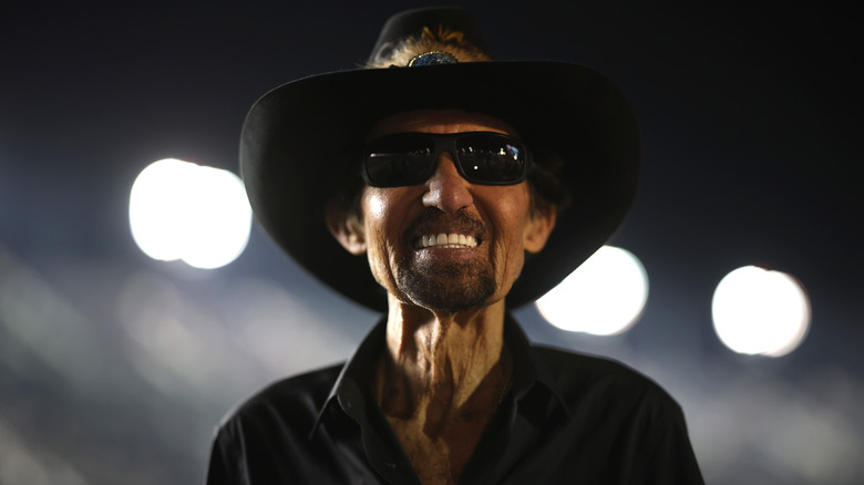 Richard Petty smiling in sunglasses and hat