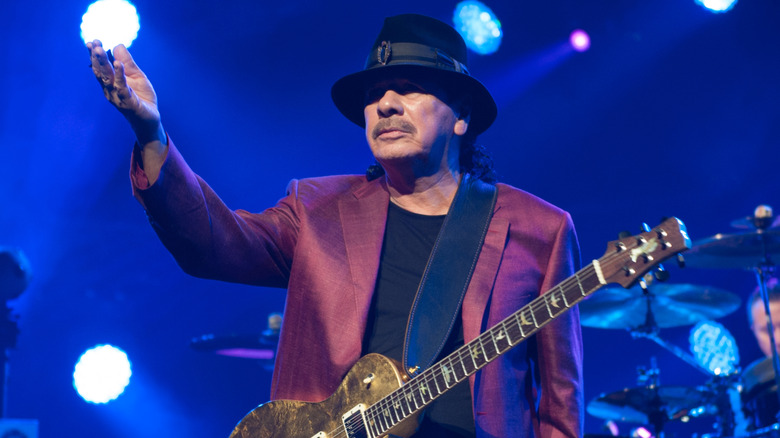 Carlos Santana with guitar onstage