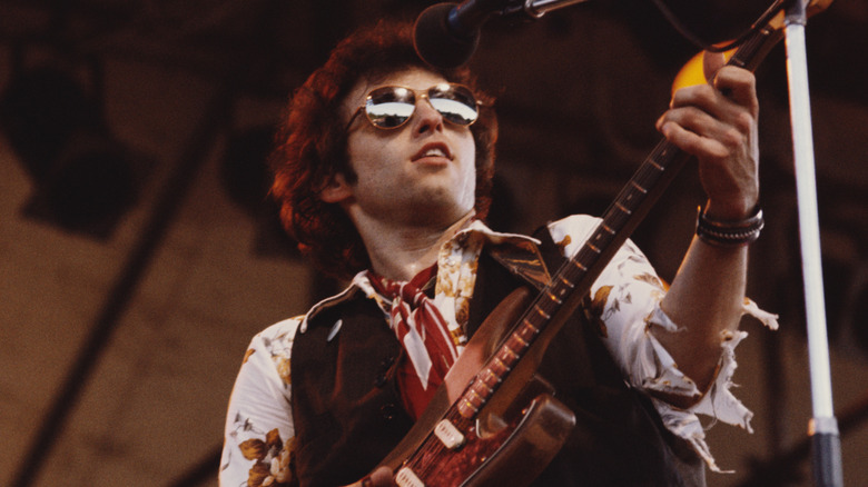 Nils Lofgren playing guitar in the 1970s