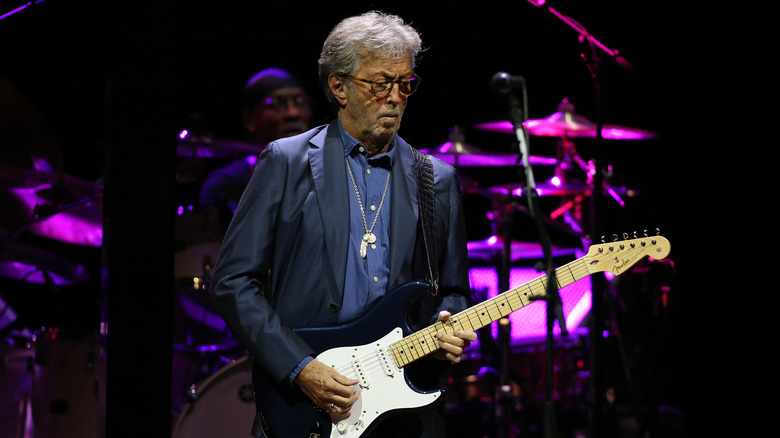 Eric Clapton plays guitar at the Royal Albert Hall