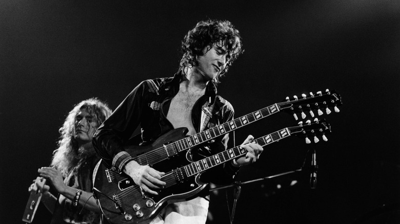 Jimmy Page on stage playing a double neck guitar