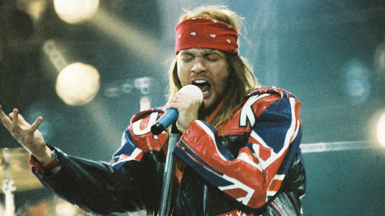 Axl Rose singing in red bandana