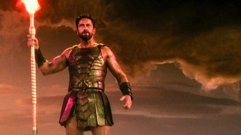 Gerard Butler holding torch 