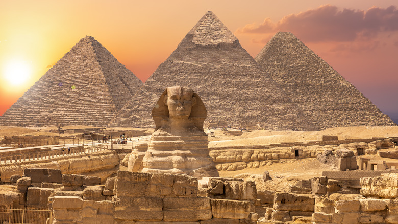 pyramids of giza under sunset