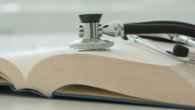 Stethoscope and textbook