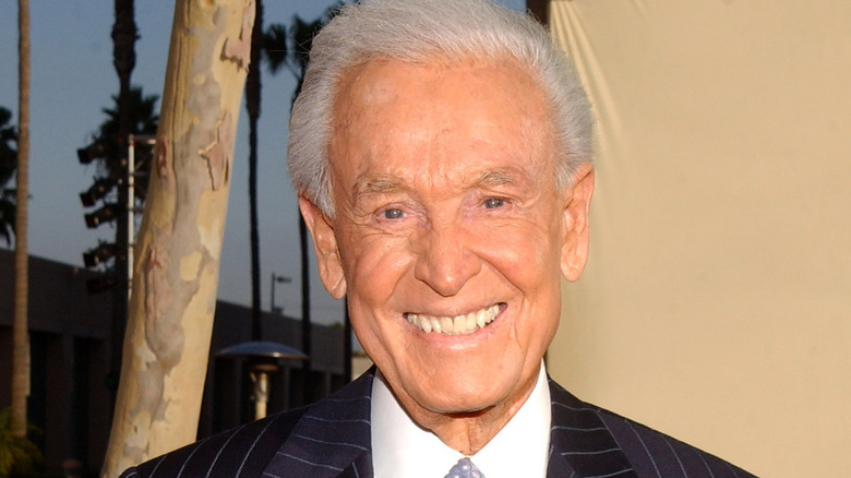 Bob Barker suit smiling outside