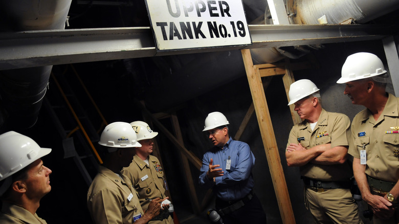 people taking tour of storage tankers at Red Hill