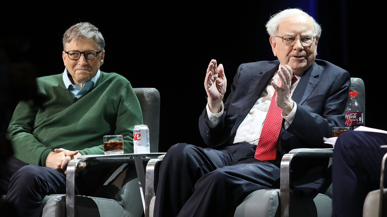 Bill Gates and Warren Buffett talking on stage