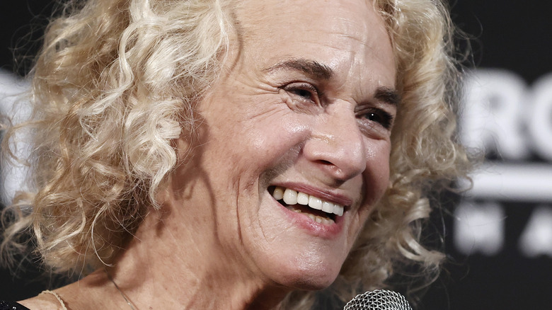 Carole King with a microphone