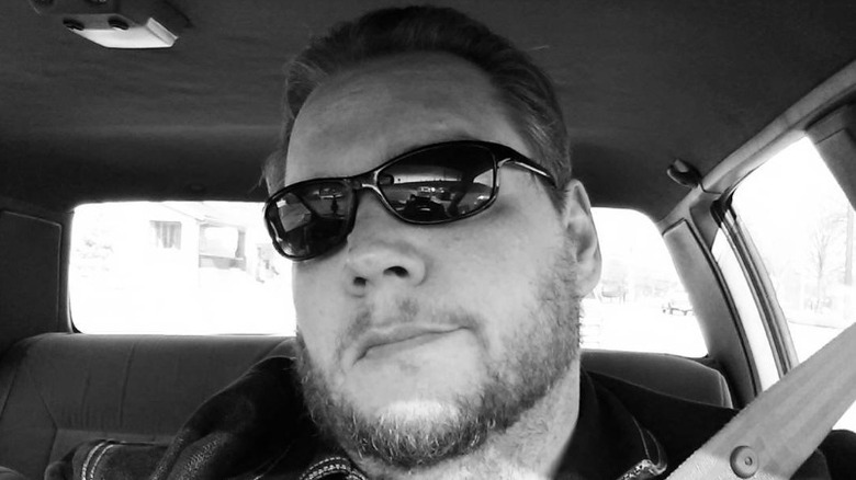 Axl Rotten wearing sunglasses