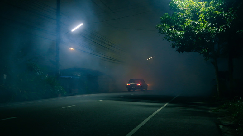 car driving on eerie road