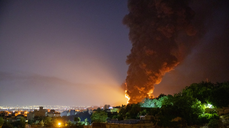 Smoke rising from attack site after Israel attack on Iran