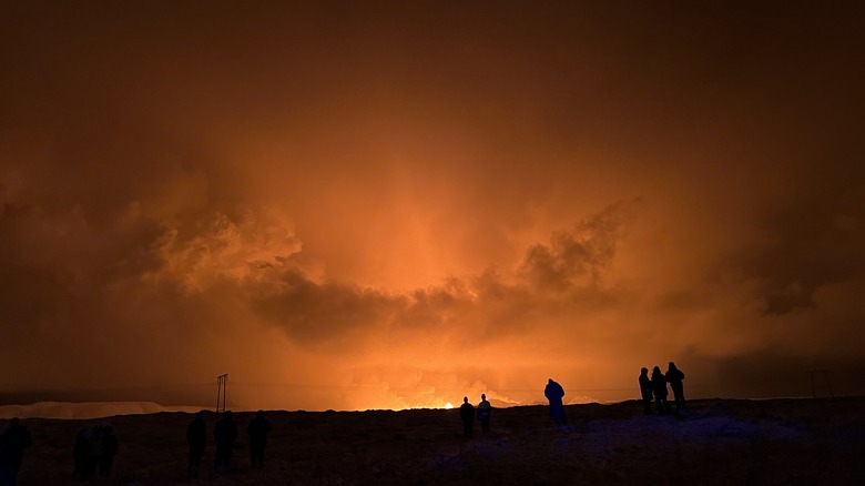 Onlookers watching Icelandic volcano eruption