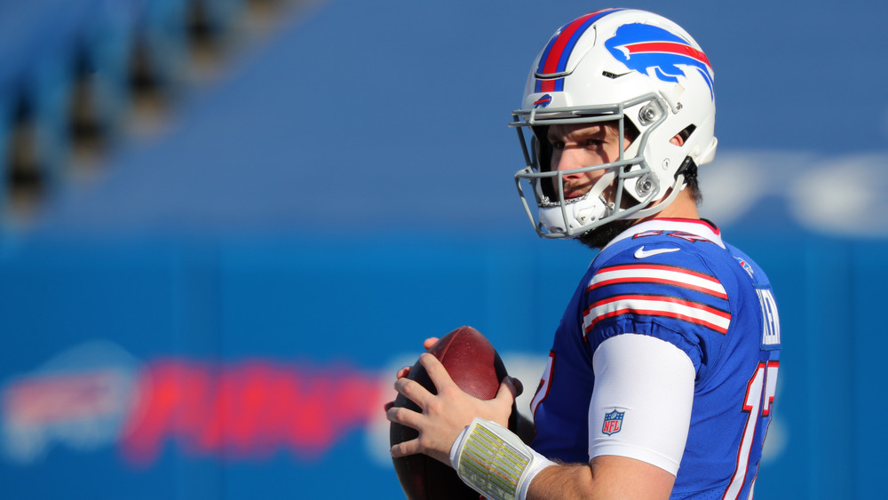 Bills' Josh Allen holding football