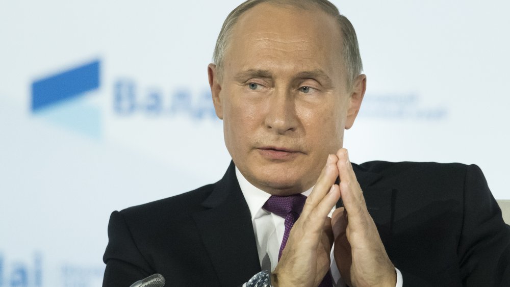 Vladimir Putin hands folded