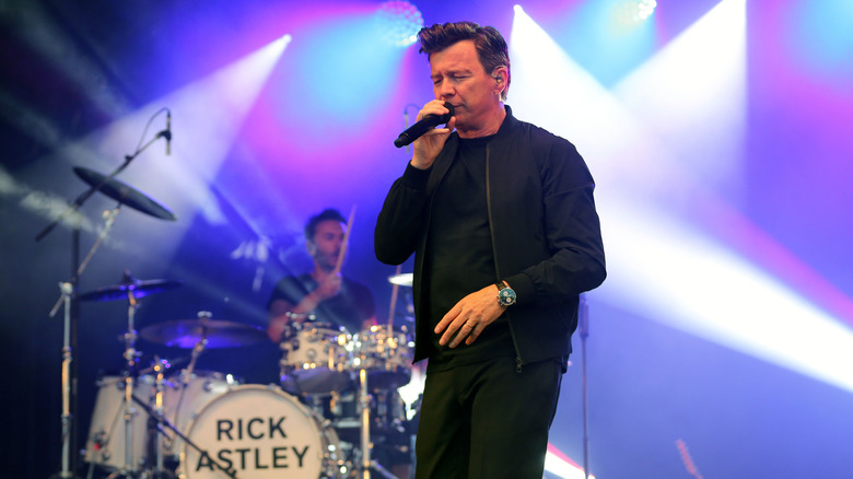Rick Astley singing on stage