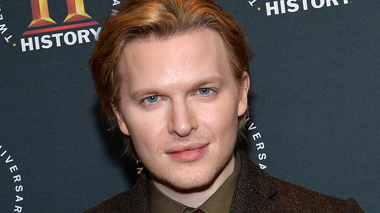 Ronan Farrow with half-smile