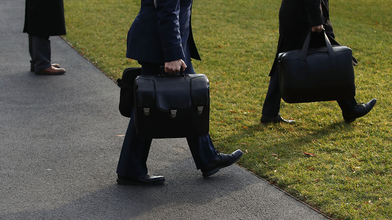 military officer carrying the nuclear football