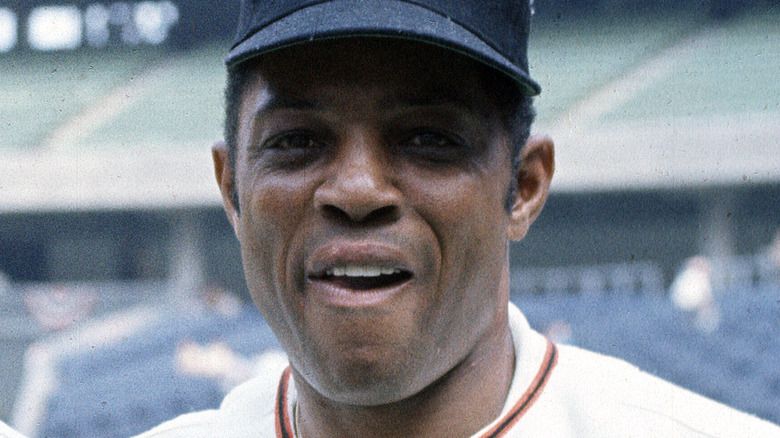 Willie Mays throwing a baseball