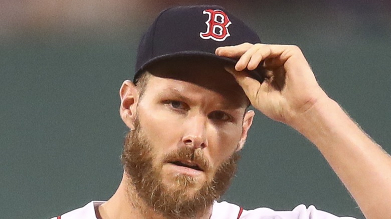 Chris Sale holding cap brim