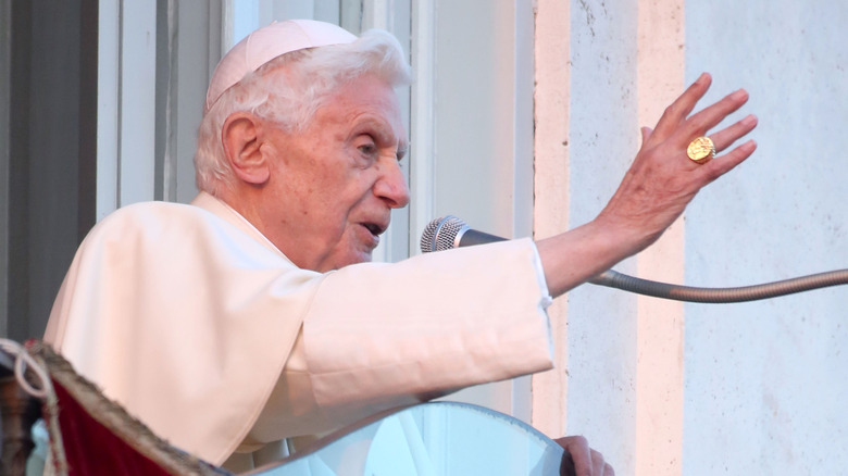 benedict XVI sat gesturing speaking into mic