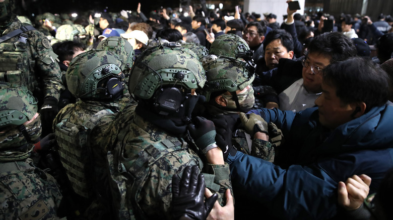 Military confronts protesters