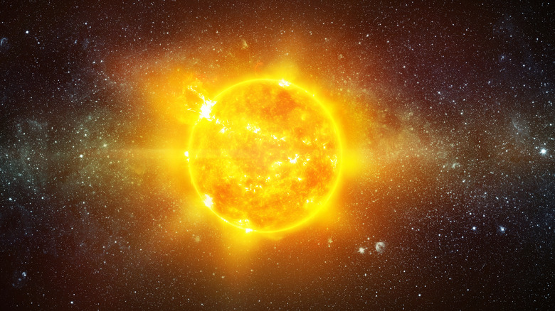 Bright yellow sun in space
