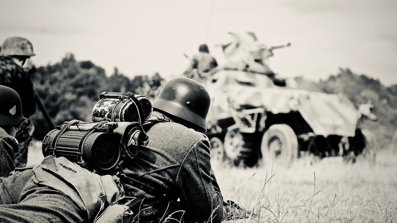 German soldier watching tank