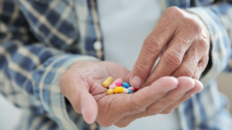 man taking his medications