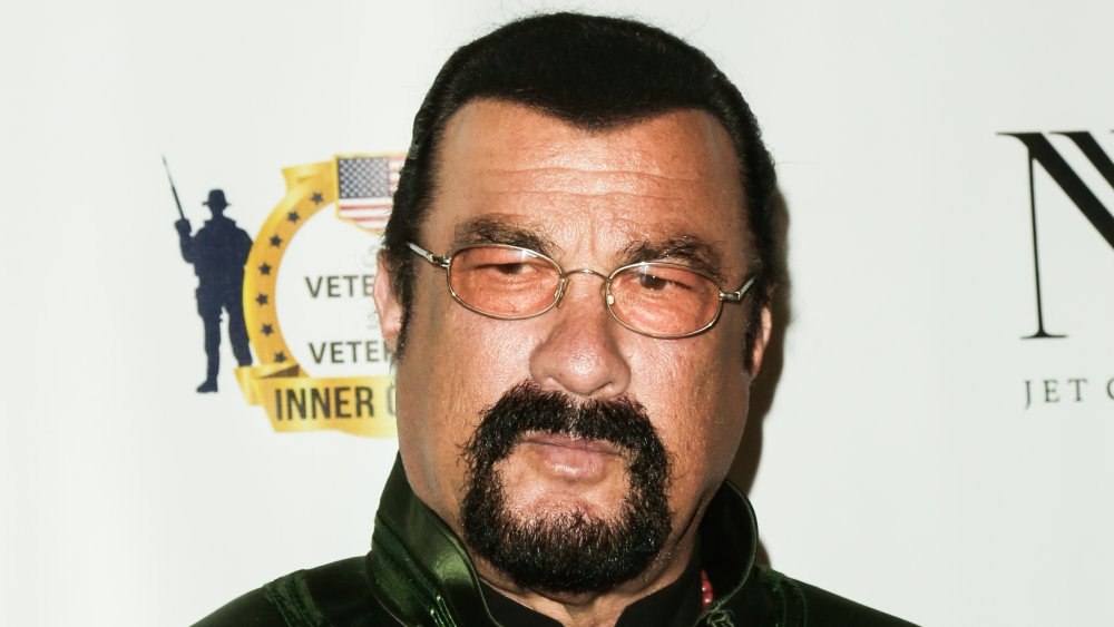 A close-up profile shot of Steven Seagal