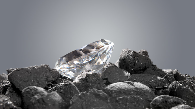 Diamond in pile of coal