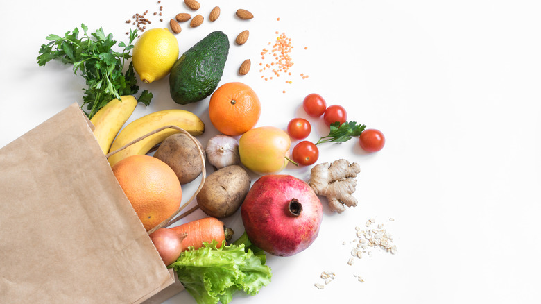 vegetables pouring from paper bag