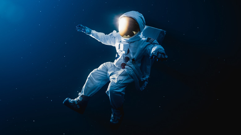 astronaut drifting in outer space