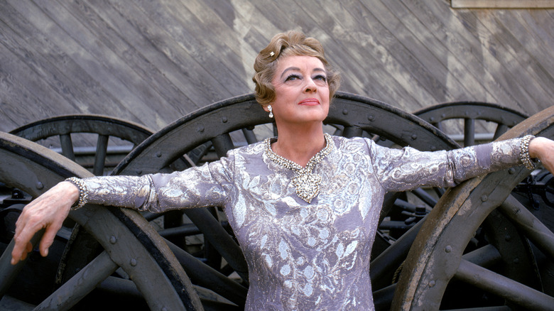 Bette Davis purple outfit