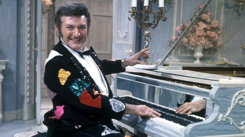 Liberace playing piano