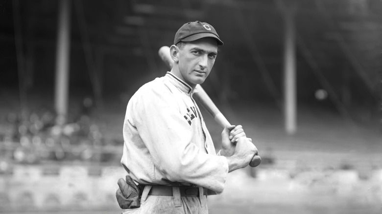 Shoeless Joe Jackson posing with a bat