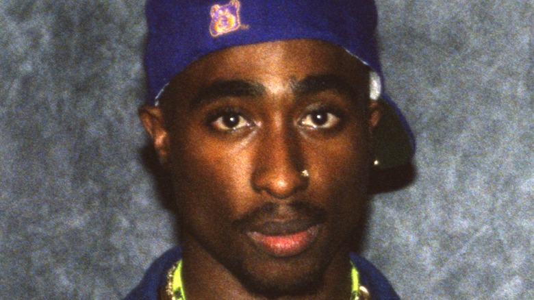 Tupac Shakur posing for a photo