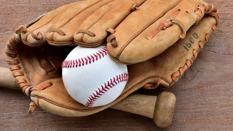 Baseball, bat, and well-worn glove