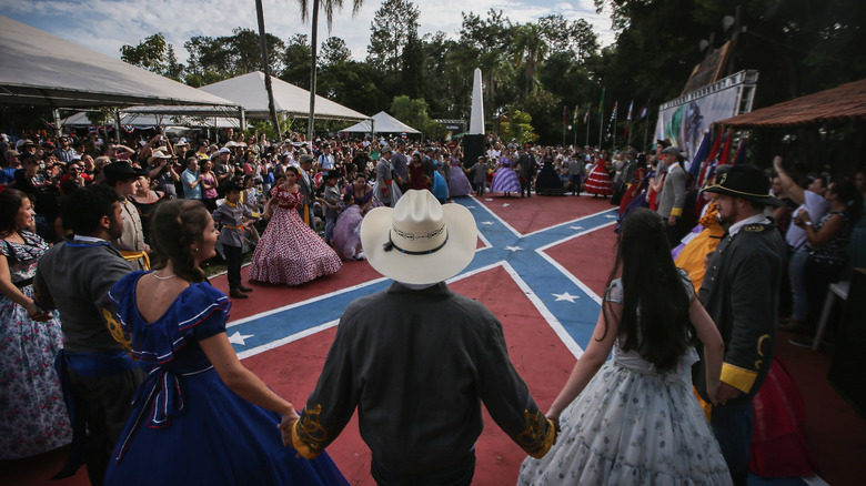 Brazilians Dance Around a Confederate Flag