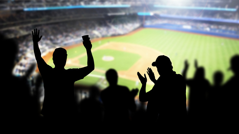 Baseball fans cheering at the ballpark