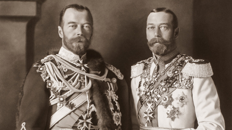 King George V and Tsar Nicholas II bearded and standing in medal-covered uniforms
