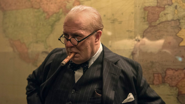 Gary Oldman with cigar and suit as Winston Churchill in "Darkest Hour"